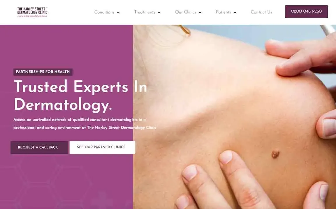 On a dermatology clinic website, a person is having their skin examined by a healthcare professional, with a focus on the shoulder area, surrounded by branded information and contact options.