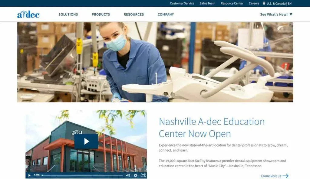 A healthcare professional wearing a blue uniform and face mask examines dental equipment in a modern facility; below, an announcement highlights the opening of the Nashville A-dec Education Center, featuring images of the center and an informative caption about its purpose.