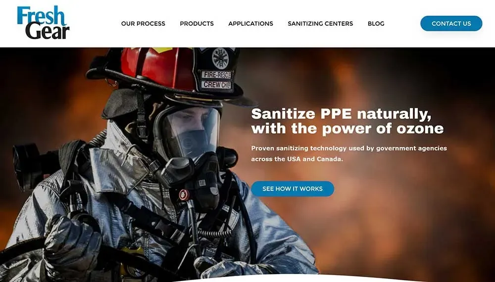 A firefighter in full protective gear stands against a backdrop of flames, showcasing Fresh Gear's ozone sanitizing solution for cleaning PPE naturally and effectively.