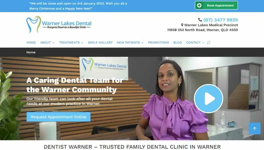 A woman in a dental office welcomes visitors on the Warner Lakes Dental homepage, highlighting their caring dental team and a call-to-action button for appointment bookings online.
