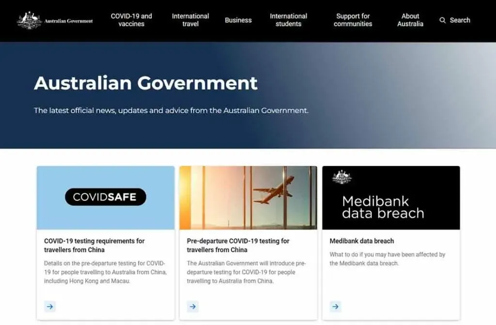 The image shows the Australian Government's website homepage featuring sections on COVID-19 testing requirements for travelers, international travel advice, and a report on the Medibank data breach.