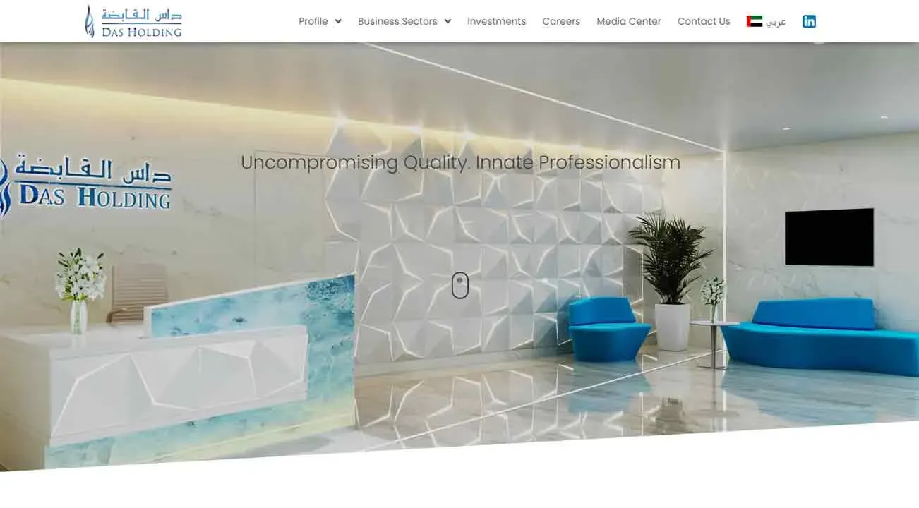 Modern office lobby with a sleek reception desk, potted plants, and contemporary geometric wall design, showcasing an inviting and professional atmosphere.