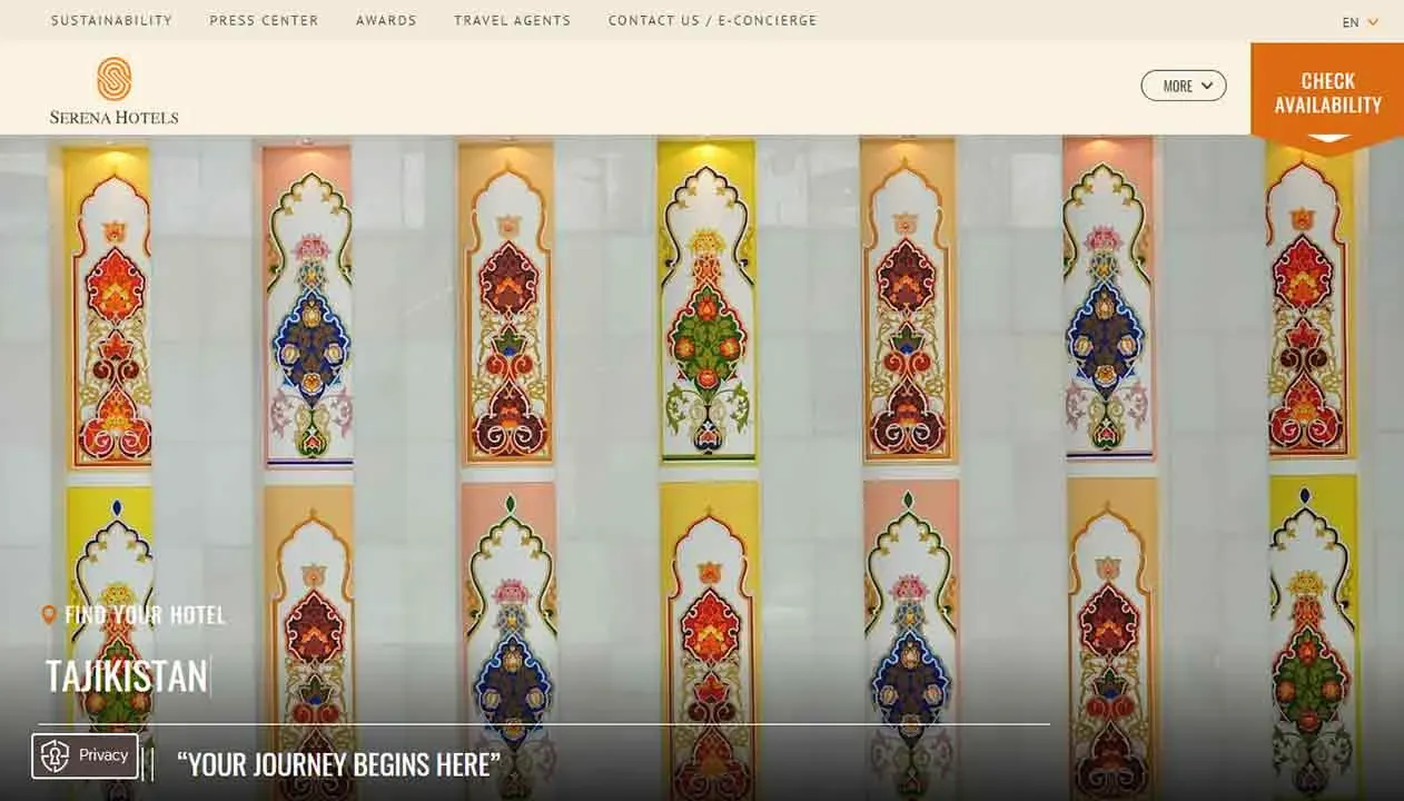 The image shows a series of intricately designed decorative columns, each adorned with vibrant floral patterns in shades of red, yellow, and purple, set against a cream-colored background, exemplifying traditional Tajikistan artistry.
