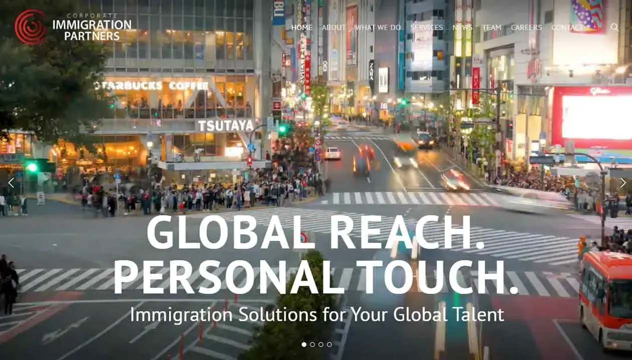 Bustling nighttime city scene with pedestrians crossing a busy intersection, vibrant storefronts including Starbucks and Tsutaya, and illuminated urban buildings, emphasizing themes of global connectivity and modern urban life.