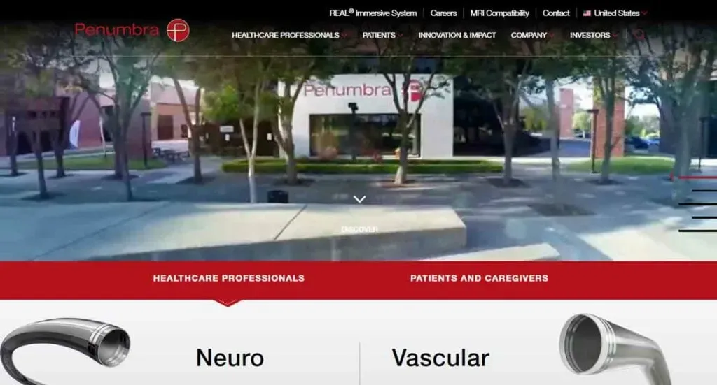 The image shows the homepage of the Penumbra website featuring a modern urban office with a prominent company logo, surrounded by trees, and the navigation bar highlights sections for healthcare professionals, patients, and caregivers.