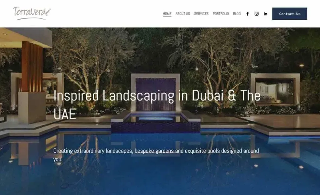 Luxurious outdoor pool area with modern design features, surrounded by lush greenery and ambient lighting, showcasing inspired landscaping in Dubai and the UAE.
