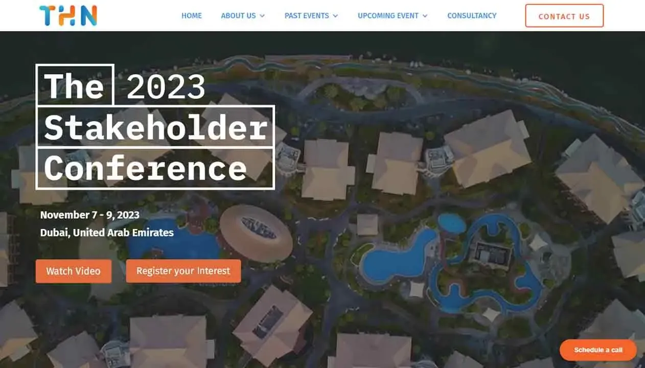 Aerial view of a resort or conference facility in Dubai with distinctive blue pool features, promoting "The 2023 Stakeholder Conference" held from November 7-9, with options to watch, register interest, or contact.