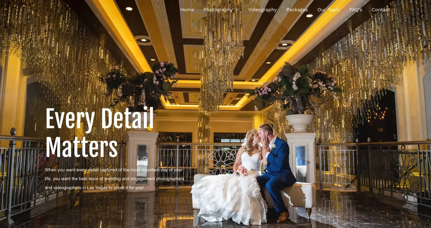 Luxurious wedding venue with opulent gold chandeliers and floral arrangements, featuring a couple seated elegantly on a white cushioned bench.