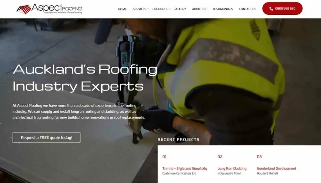 A person in a high-visibility vest is working with roofing equipment on a construction site, with a header promoting Auckland's roofing industry experts visible in the background.