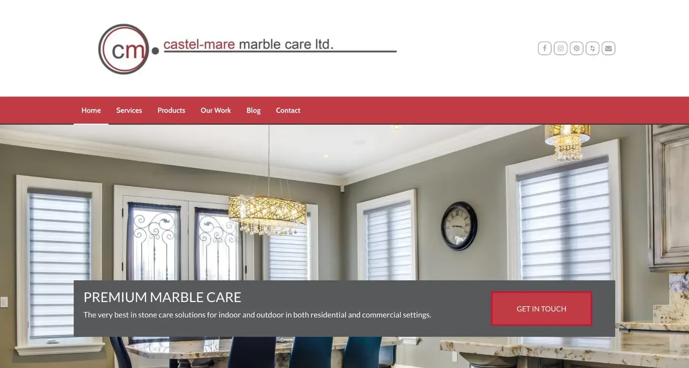 The website homepage showcases a sleek design with a modern gray and red theme, featuring a prominent header for Castel-Mare Marble Care Ltd., menu navigation options like home, services, and products, and a large image of an elegant interior with marble surfaces and stylish chandeliers.