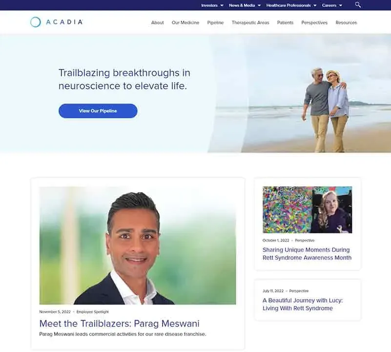 A middle-aged couple holding hands while walking on a beach, smiling with the ocean and blue sky in the background, complemented by website sections highlighting recent news and profiles in neuroscience.