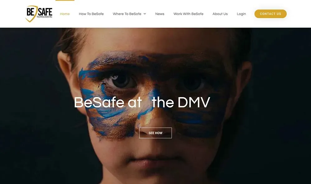 A child with brown eyes looks directly at the camera, their face painted with abstract blue and brown patterns, featured on a website with navigation links for BeSafe services.