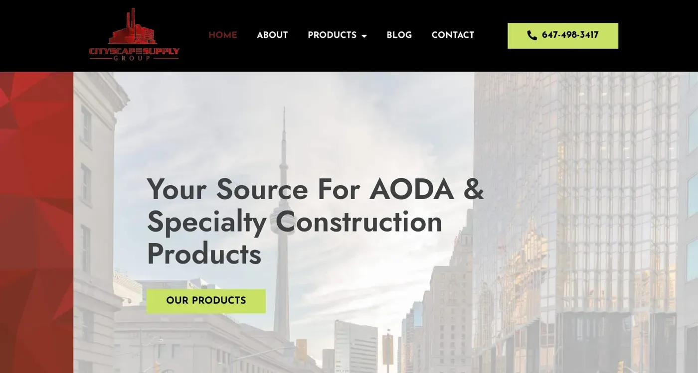 Website homepage displaying a cityscape banner with skyscrapers and a prominent CN Tower, featuring a message about AODA and specialty construction products along with navigation links for home, about, products, blog, and contact.