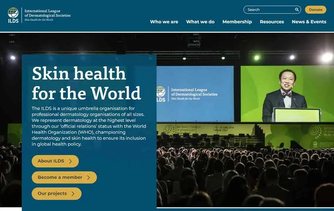 The image features a conference stage with a speaker addressing an audience, displaying a presentation titled "Skin health for the World" from the International League of Dermatological Societies, focusing on global health policies related to dermatology.