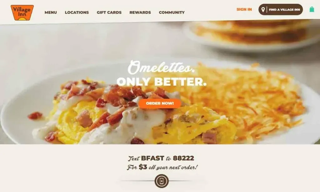A delicious omelette topped with diced ham and creamy sauce is served alongside crispy hash browns, with a stack of pancakes partially visible in the background, featuring a banner that reads "Omelettes. Only Better." from Village Inn.