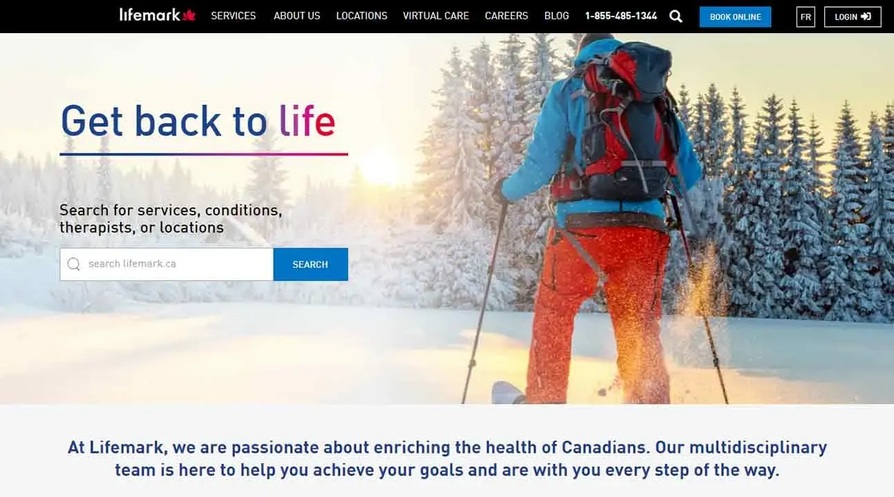A skier in vibrant red and blue attire navigates through a snow-covered landscape, surrounded by frosty trees under a clear, bright sky, capturing the essence of winter sports and outdoor adventure.
