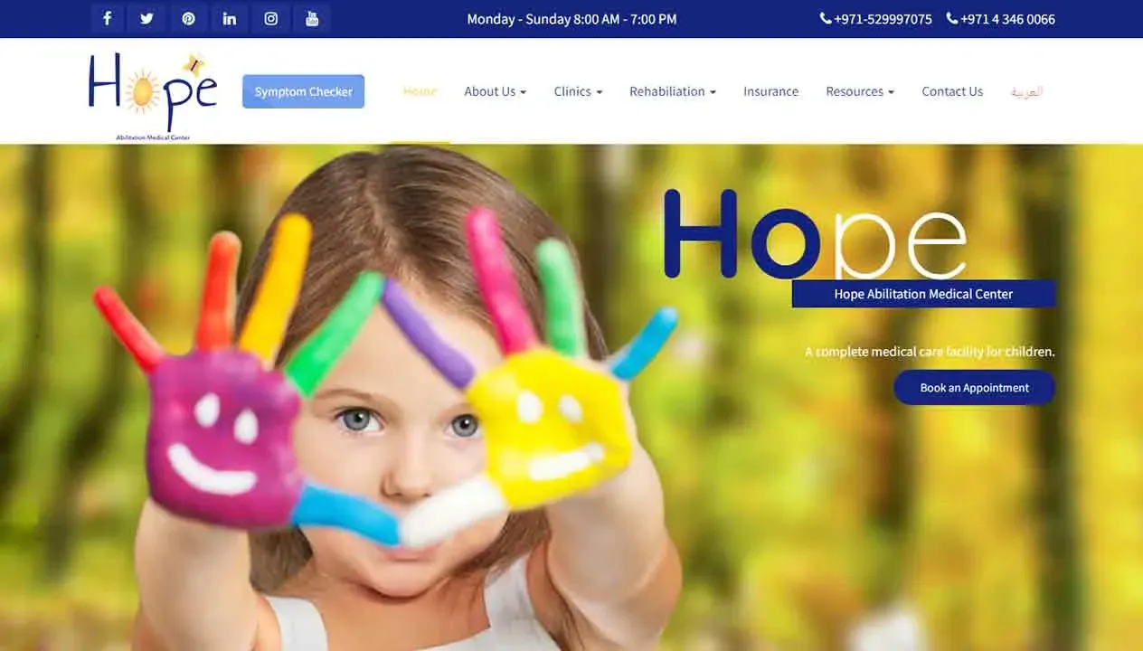 A child holding colorful hand-shaped clay art with smiley faces in front of a blurred natural background, displayed on the homepage of the Hope Abilitation Medical Center website.