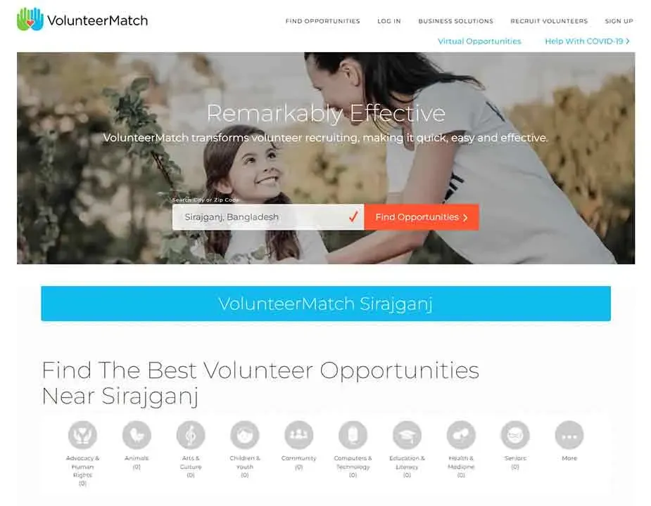 The image showcases the VolunteerMatch website homepage, featuring a search bar for finding volunteer opportunities in Sirajganj, Bangladesh, with a backdrop of a smiling person and child against a greenery-filled background, highlighting its mission to streamline volunteer recruitment.