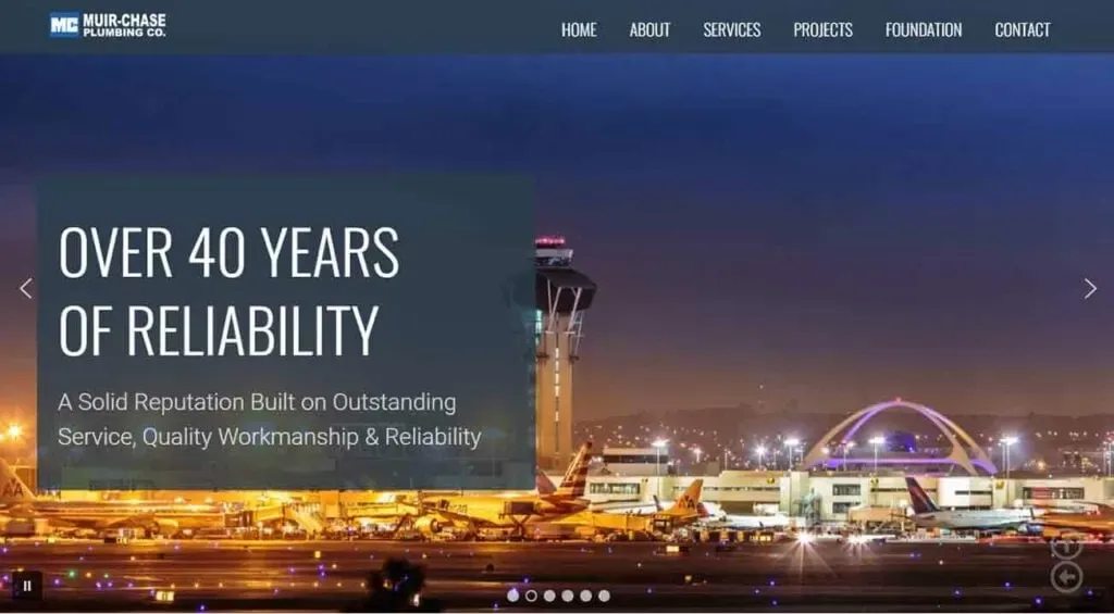 The image showcases a nighttime view of a well-lit airport terminal with an illuminated control tower and buildings, emphasizing themes of reliability, quality workmanship, and long-standing reputation in plumbing services.
