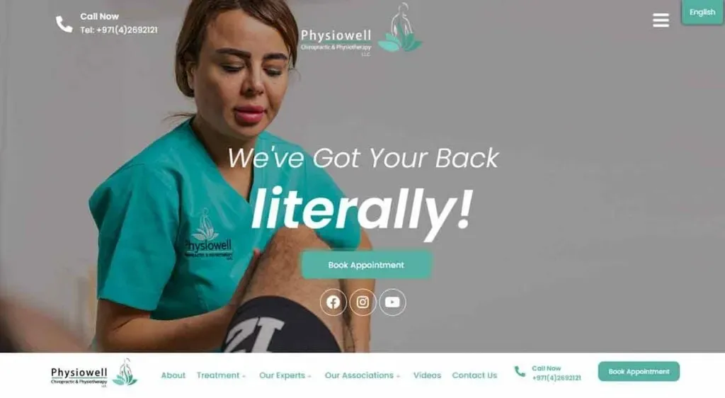 A physical therapist in a teal uniform, labeled with the logo "Physiowell," gently massages a client's knee in a clinic setting, with the text "We've Got Your Back, literally!" displayed prominently above.