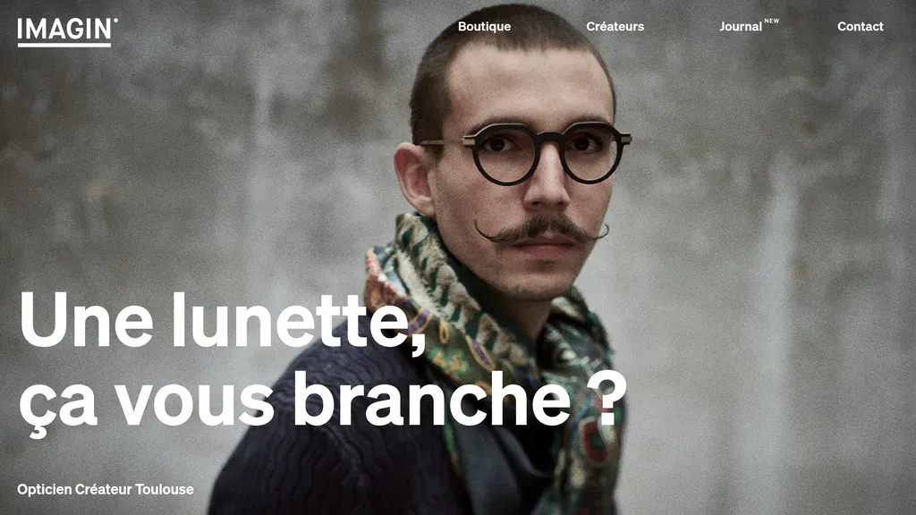 Imagin Optique homepage with a portrait of a mustachioed man in round glasses and the French headline "Une lunette, ça vous branche?"
