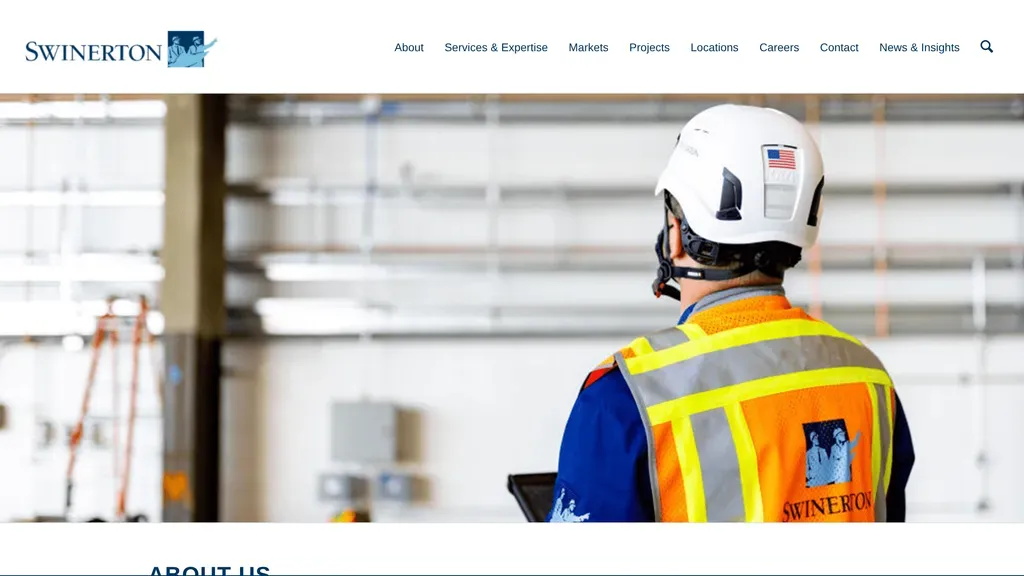 Swinerton homepage with a photo of a builder in safety gear reviewing plans