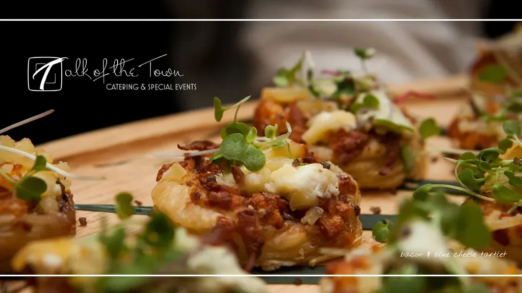 Talk of the Town Catering homepage with a close-up of gourmet appetizers over a dark background