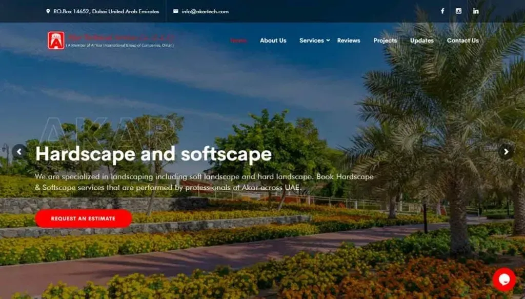 A beautifully landscaped garden scene featuring lush greenery, vibrant flowers, and palm trees set against a clear blue sky, promoting hardscape and softscape services in the UAE.
