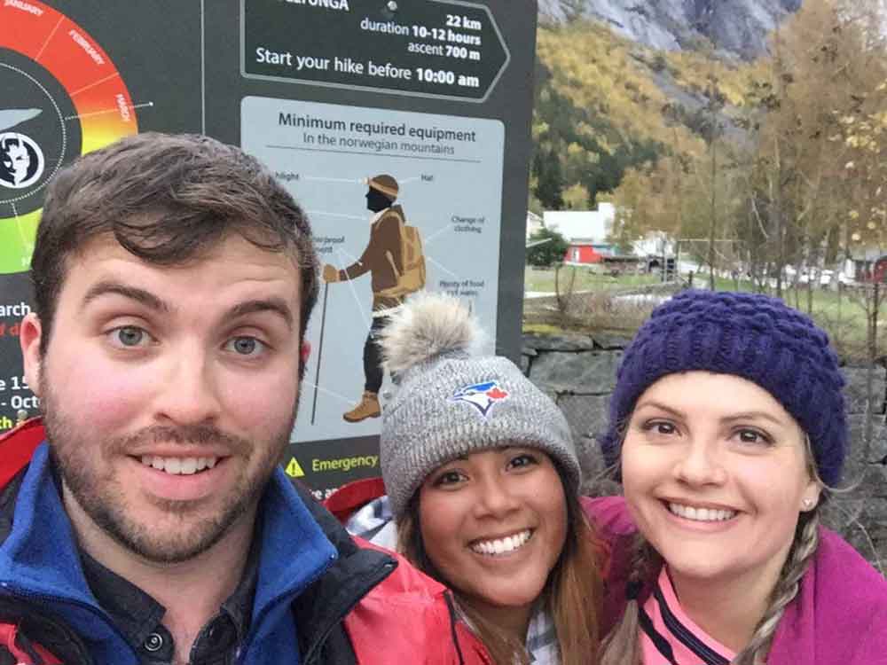 Hiking friends on the rocky Trolltunga trail in Norway